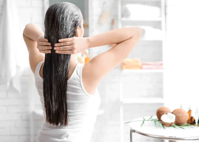 Woman is applying Nature Plex Instant Mask with essential oils for hair